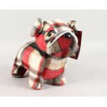 A TARTAN BULL DOG DOOR STOP.