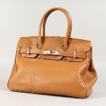 A HERMES TAN LEATHER BIRKIN STYLE BAG.