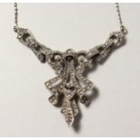 A SILVER AND MARCASITE PENDANT AND CHAIN.