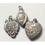 THREE SILVER PERFUME BOTTLES.