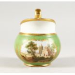 A RUSSIAN GREEN GROUND JUG with a village scene. 5ins high.