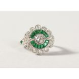 A SILVER FAUX EMERALD DECO STYLE RING.