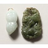 TWO CARVED JADE GOLD TOP PENDANTS.