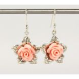 A PAIR OF SILVER AND CORAL FLOWER EARRINGS.