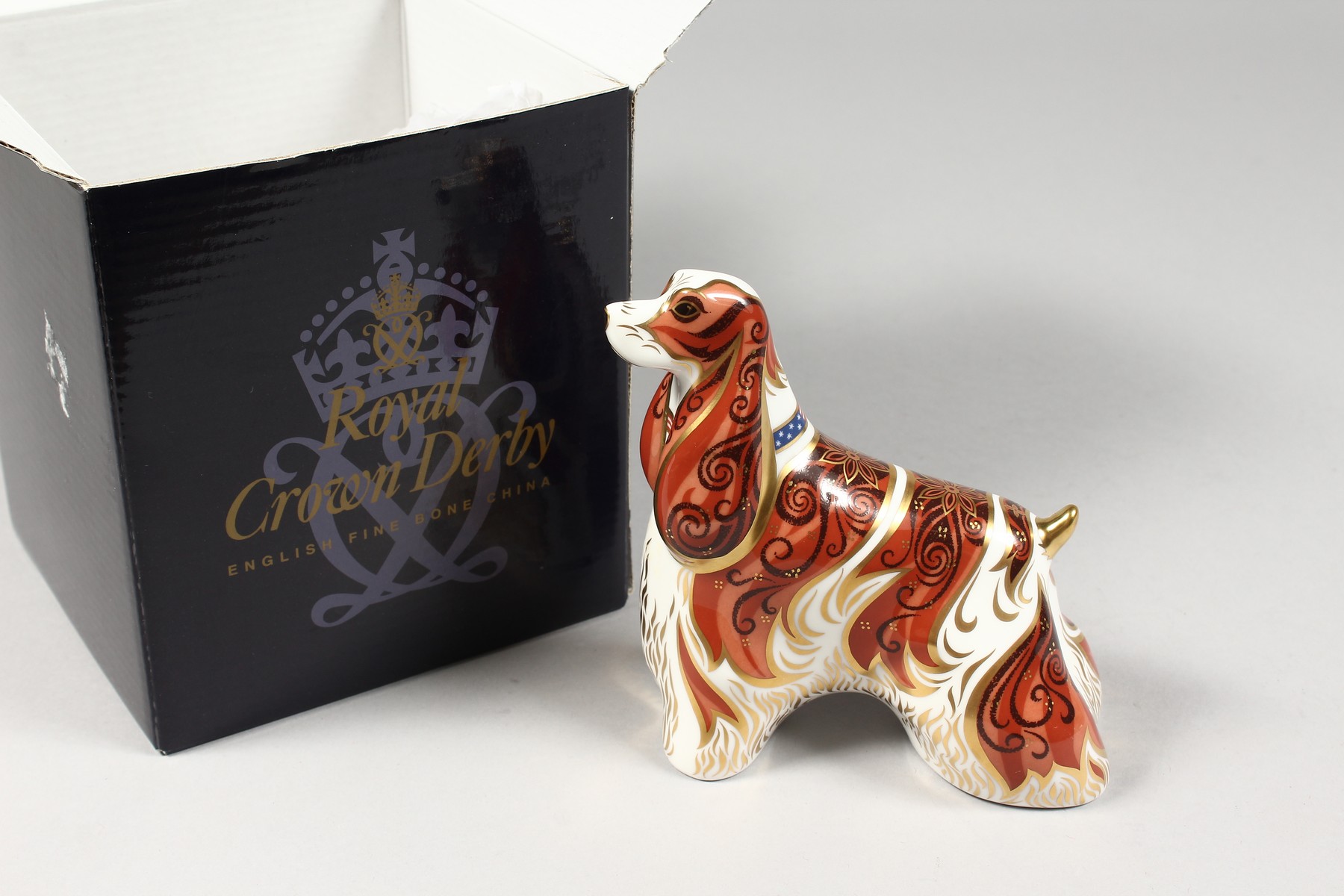 A ROYAL CROWN DERBY AMERICAN SPANIEL DOG PAPERWEIGHT, gold stopper and box. - Image 9 of 9