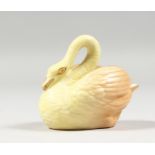 A ROYAL WORCESTER RARE BLUSH IVORY MINIATURE MODEL OF A SWAN, date code 1903.