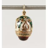 A RUSSIAN SILVER AND ENAMEL EGG PENDANT.