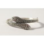 A SILVER DOUBLE HEADED SNAKE BANGLE.