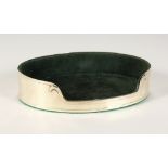 A SILVER OVAL JEWELLERY STAND with velvet interior. 7ins long.