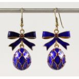 A PAIR OF RUSSIAN BLUE ENAMEL AND RIBBON EGG EARRINGS.