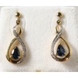 A PAIR OF 9K GOLD PEAR SHAPED SAPPHIRE AND DIAMOND DROP EARRINGS.