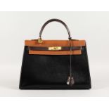 A GOOD HERMES TWO COLOUR LEATHER KELLY BAG, dark and light brown with brass lock. No. 212. 13ins