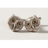 A PAIR OF SILVER OWL CUFFLINKS.