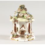 A COALPORT PORCELAIN FLOWER ENCRUSTED PASTILLE BURNER. 4.5ins high.