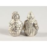 A PAIR OF .925 SILVER PLATE PUNCH & JUDY SALT AND PEPPER.