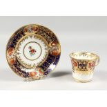AN EARLY 19TH CENTURY CHAMBERLAIN WORCESTER CUP AND SAUCER painted in an Imari style pattern 293.