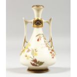 A ROYAL WORCESTER IVORY TWO HANDLED VASE painted with roses highlighted with gilding, date blue mark