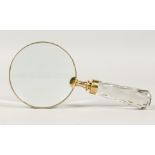 A MAGNIFYING GLASS with cut glass handle.