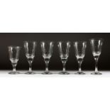 SIX HEAVY WINE GLASSES in three sizes.