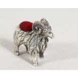 A CAST SILVER RAM PIN CUSHION.