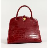 A VERY GOOD HERMES DARK RED CROCODILE LEATHER HANDBAG. 10ins long x 8.25ins high.