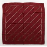 A GUCCI MAROON SILK SCARF, 26ins x 24ins.