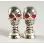 A PAIR OF .925 SILVER PLATE SKULL SALT AND PEPPER.