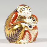 A ROYAL CROWN DERBY PAPERWEIGHT MONKEY and baby, gold stopper and box.