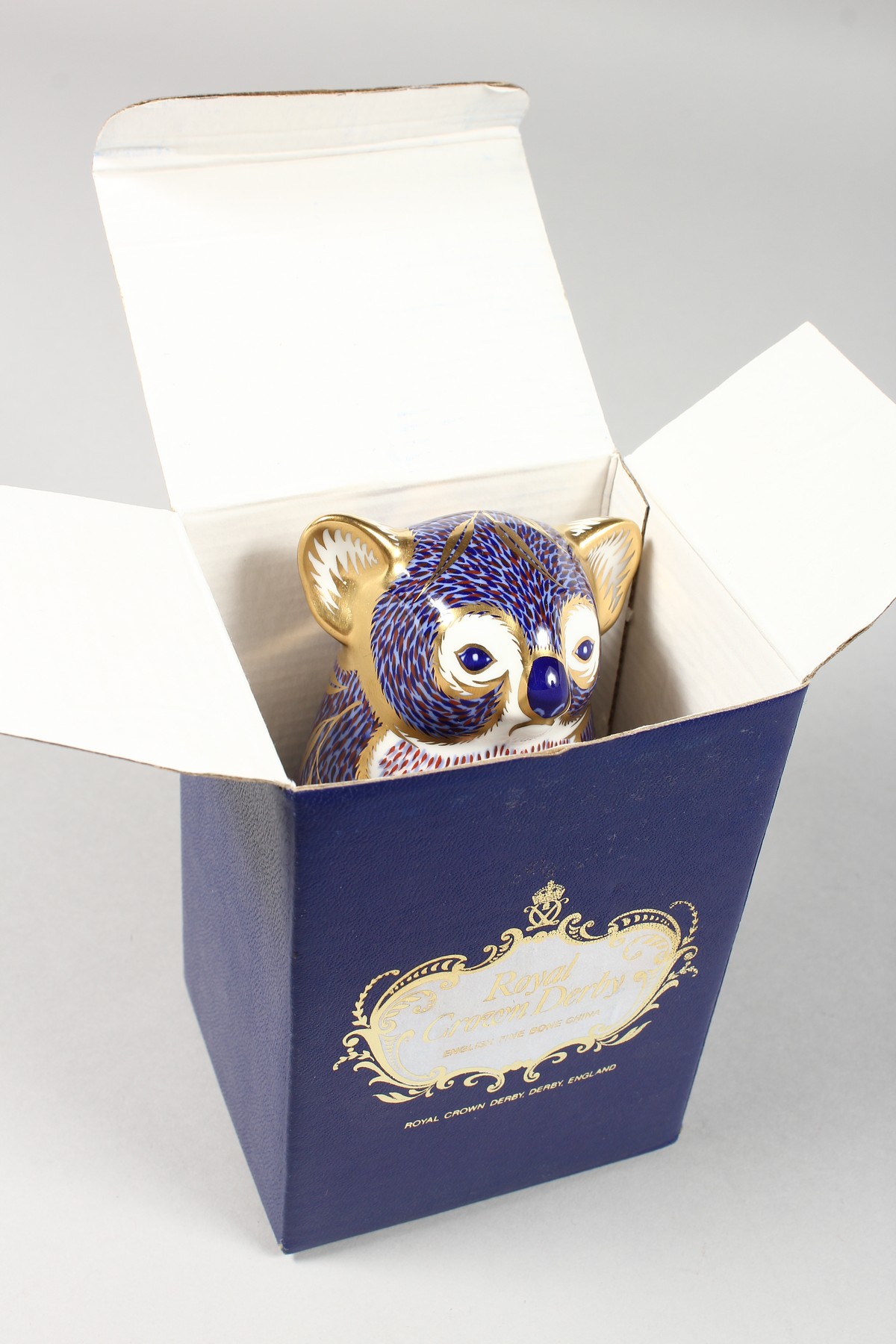 A ROYAL CROWN DERBY PAPERWEIGHT KOALA, gold stopper and box. - Image 7 of 7