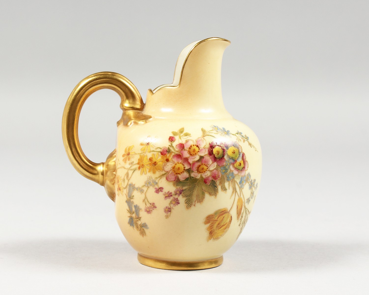 A ROYAL WORCESTER BLUSH IVORY JUG painted with roses, highlighted with gilding, date code for