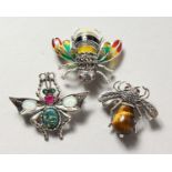THREE SILVER AND ENAMEL BUG BROOCHES.