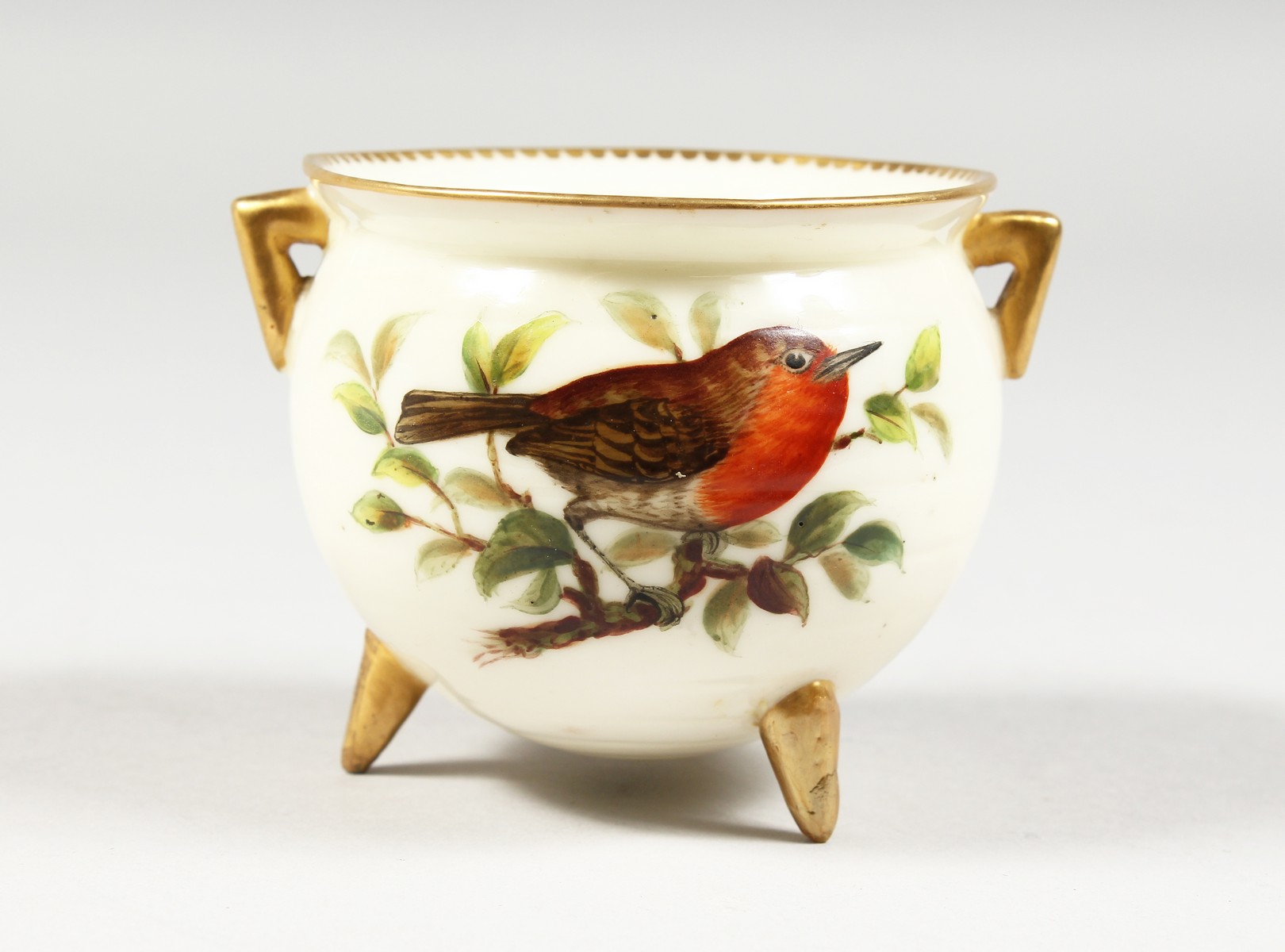 A ROYAL WORCESTER CAULDRON on three conical feet painted with a bird by Hopewell, blue mark, 1880'
