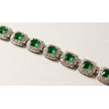 A GOOD SILVER AND GREEN STONE LINE BRACELET.