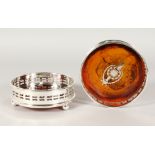 A PAIR OF CIRCULAR FAUX TORTOISESHELL COASTERS, pierced sides, on three ball feet. 5ins diameter.