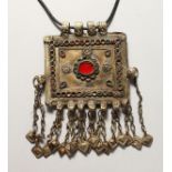 AN ISLAMIC PENDANT AND CHAIN.