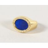 AN 18CT GOLD, LAPIS AND DIAMOND RING.