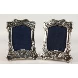 A PAIR OF SILVER PHOTOGRAPH FRAMES. 8ins x 6ins.