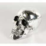 A LARGE SILVER PLATE SKULL. 10ins high.