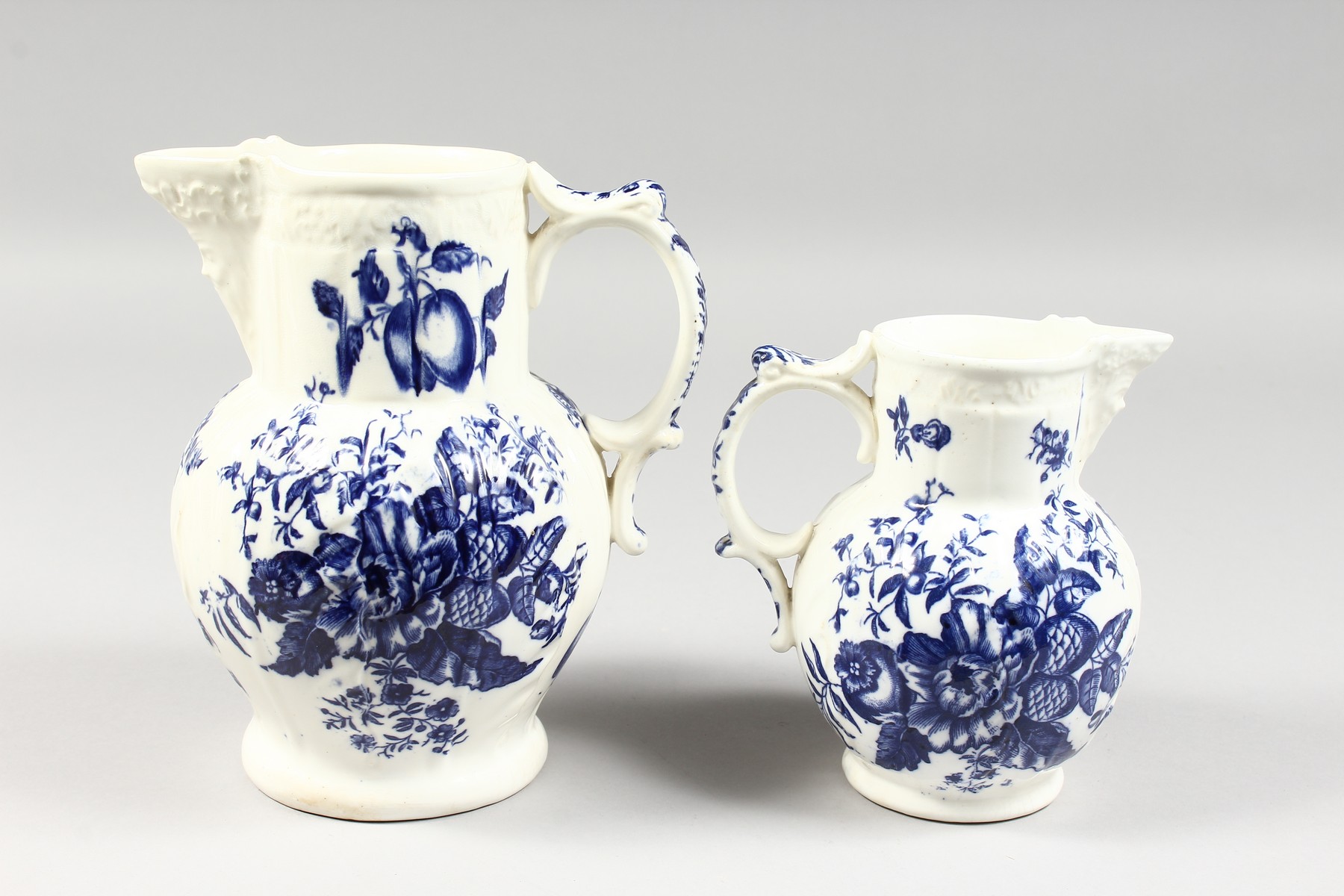 A GRADUATED PAIR OF DECORATIVE ENGLISH PORCELAIN MASK JUGS printed with fir cones and roses in - Image 6 of 9