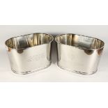 A PAIR OF PLATED OVAL WINE COOLERS. 17ins long.