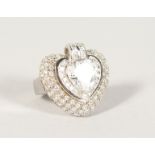 A SILVER AND CZ HEART SHAPED RING.