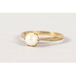 A 9CT GOLD PEARL RING.