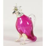 A SMALL CRANBERRY GLASS COCKATOO JUG with plated head and feet. 6ins high.