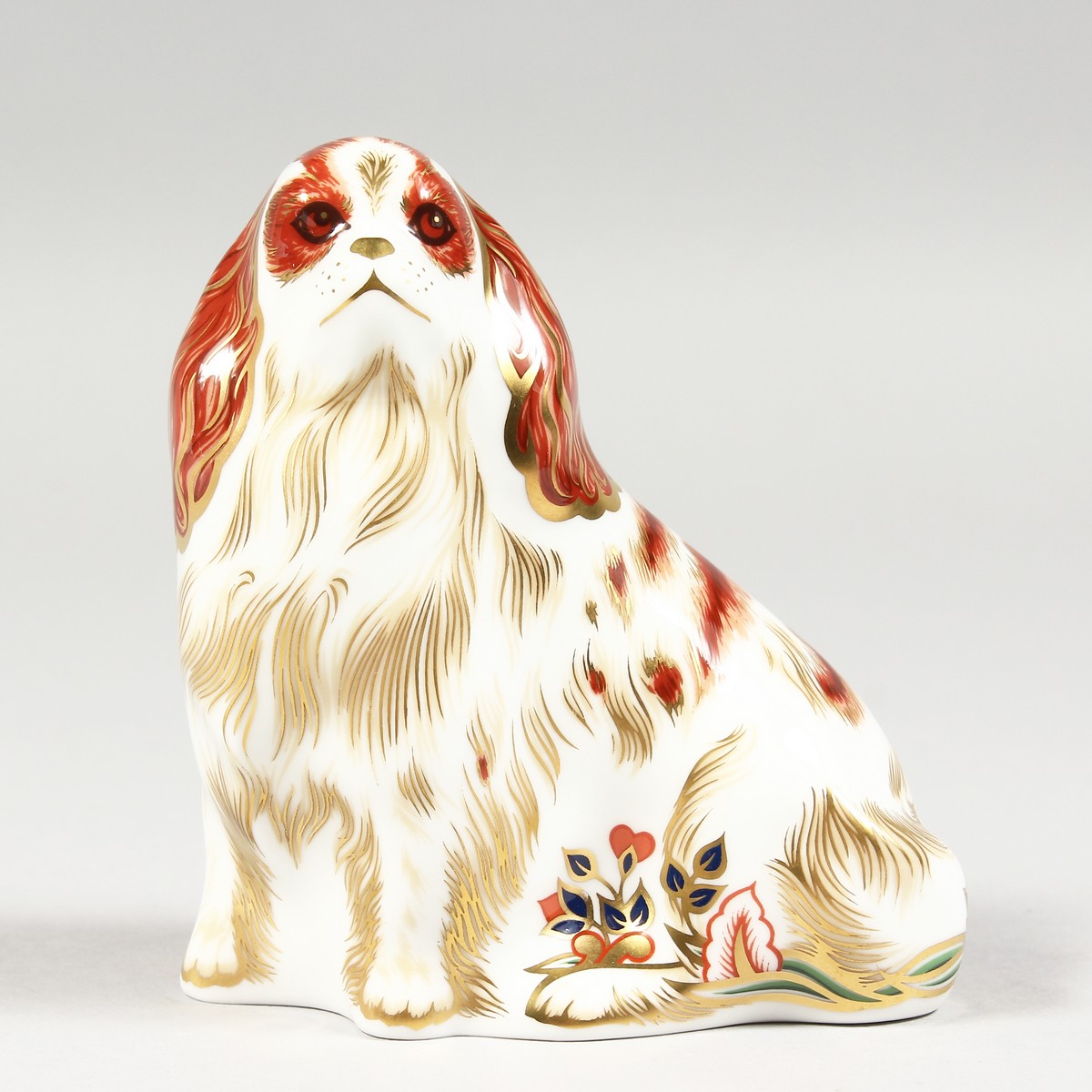 A ROYAL CROWN DERBY PAPERWEIGHT CAVALIER KING CHARLES SPANIEL, gold stopper and box.