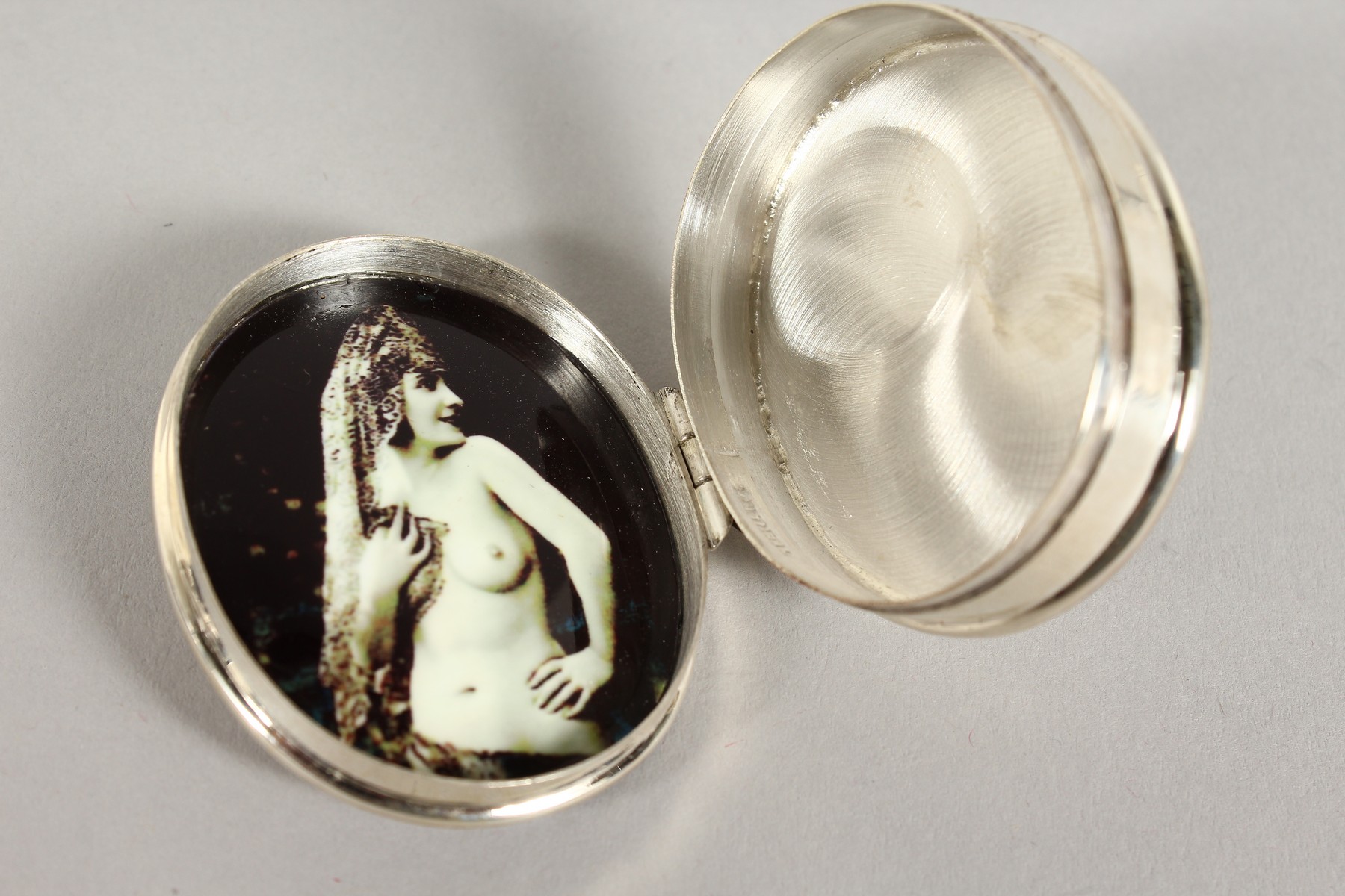A SILVER SECRET NUDE OVAL PILL BOX. - Image 2 of 2