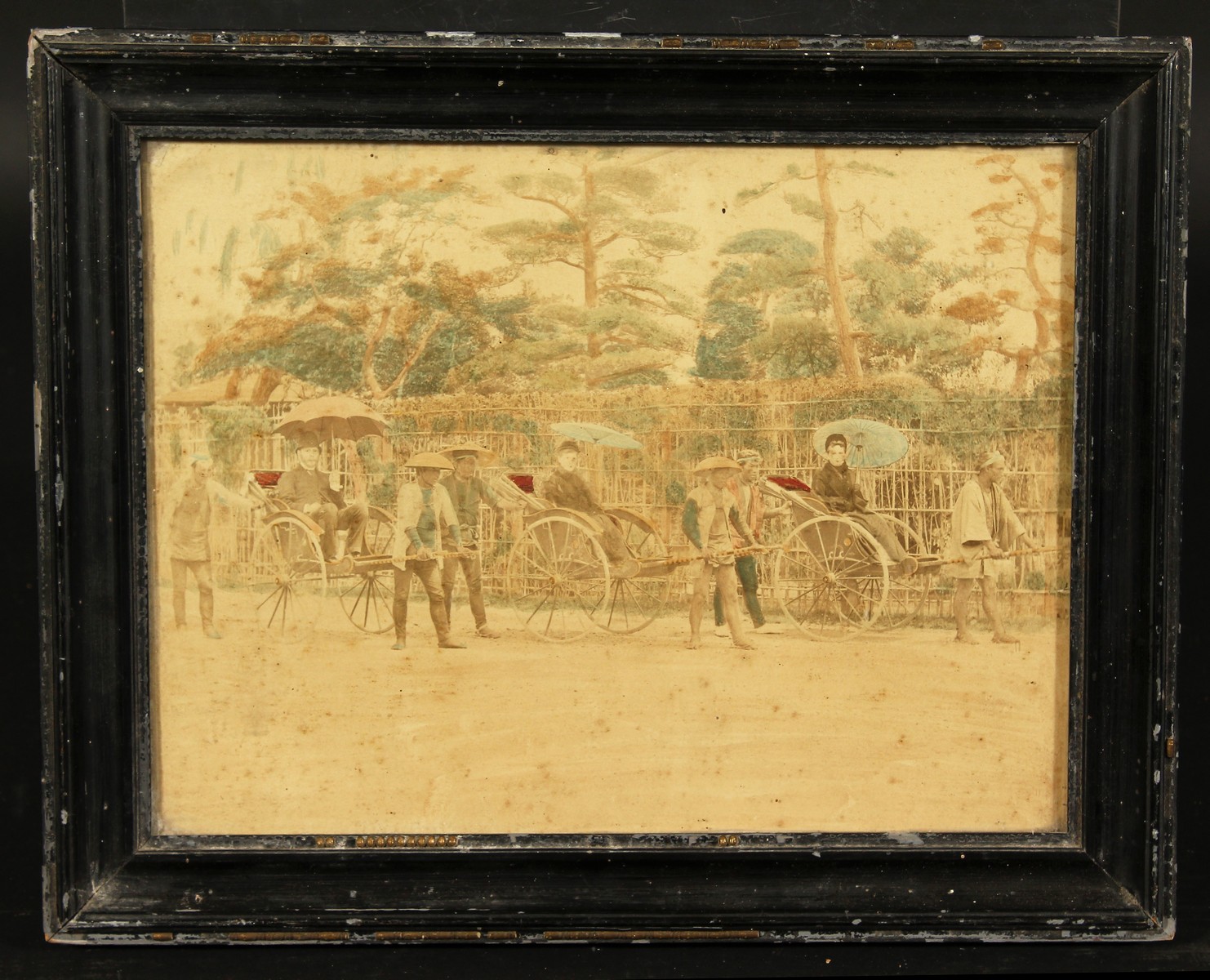 Japanese (c. 1880-1890), A colonial scene of figures on rickshaws, hand-tinted photograph, 8" x - Image 2 of 3