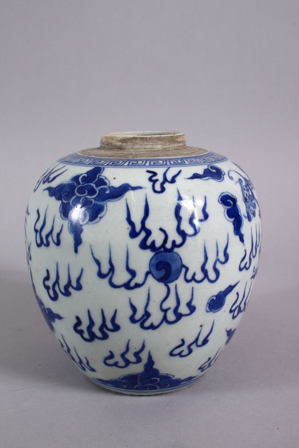 A CHINESE BLUE & WHITE PORCELAIN DRAGON GINGER JAR, decorated with a dragon amongst clouds 14cm - Image 2 of 5