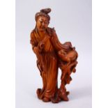 A CHINESE CARVED WOODEN FIGURE OF GUANYIN & ANIMAL, stood aside a tree stump with an a animal,