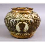 A GOOD EARLY ISLAMIC POTTERY CALLIGRAPHIC VASE, with a green / brown glaze with bands of