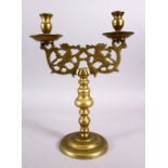 A 19TH CENTURY BRONZE JEWISH CANDLESTICK, with beast openwork, 37cm x 27cm